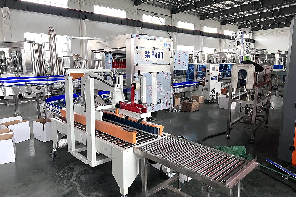grab type carton box case packing packaging and sealing machine for plastic PET glass bottle aluminum can.jpg